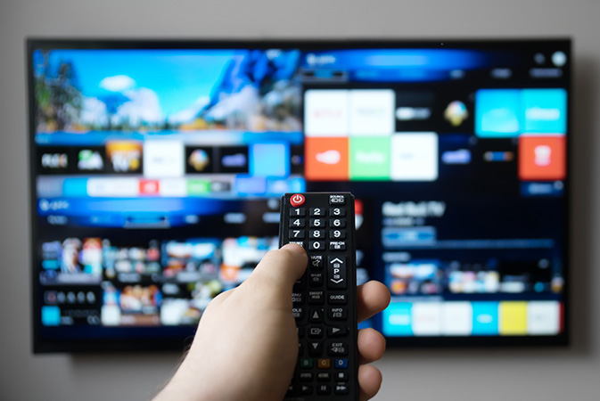 A person using the television remote